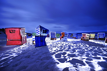 Dramatically illuminated beach chairs at night, Langeoog Beach, East Frisian Islands, Germany, Europe