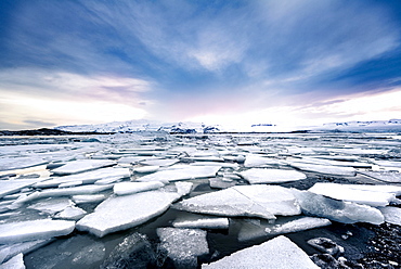 Ice floes, glacier Jokulsarlon lagoon, glacier lake, sunset, southern edge of Vatnajokull, southeast Iceland