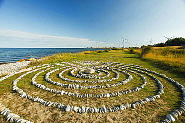 Stone circles and wind farm on the Baltic Sea coast, near Klausdorf, Fehmarn Island, Schleswig-Holstein, Germany, Europe