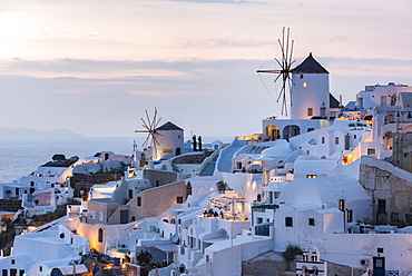 Townscape with windmills, dusk, Oia, Santorini, Cyclades, Greece, Europe