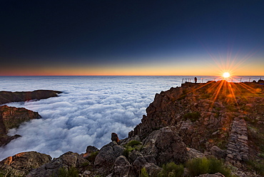 Sunrise over sea of mist, photographer on mountain peak, Pico de Arieiro, Funchal, Madeira