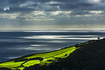 Atmospheric light over the sea, near Cedros, island of Flores, Azores, Portugal, Europe