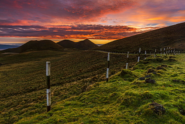 Volcano cone and street at sunrise, dramatic lighting scene, island of Pico, Azores, Portugal, Europe