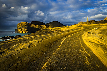 Rocky coast with lighthouse Farol da Ponta dos Capelinhos, Capelinhos peninsula, island of Faial, Azores, Portugal, Europe