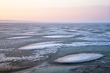 Evening atmosphere at the frozen Lake Neusiedl, near Illmitz, Seewinkel, Burgenland, Austria, Europe