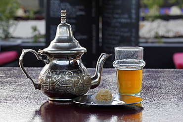 Moroccan silver teapot, glass of mint tea, Marrakesh, Morocco, Africa