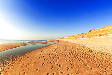 Footprints on the Weststrand beach, red cliff, Kampen, Sylt, North Frisia, Schleswig-Holstein, Germany, Europe