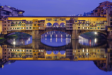 Ponte Vecchio over the Arno with symmetrical reflection in water, Blue Hour, Florence, Tuscany, Italy, Europe