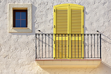 White house facade with a balcony, a yellow balcony door and a small window, Villaricos, Cuevas del Almanzora, Almeria province, Andalucia, Spain, Europe