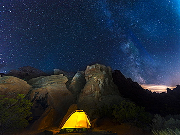 Tent on a campsite with starry sky above and Milky Way, night scene, Valley of Fire, Nevada, USA, North America