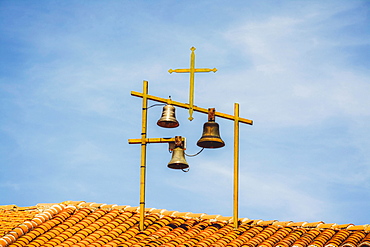 Bells and Crosses on the roof of a church, Haute-Loire department, Auvergne, France, Europe