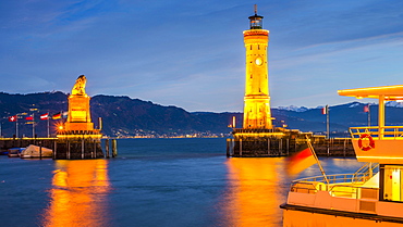 Harbor with Lighthouse and Bavarian Lion at dusk, Lindau, Lake Constance, Bavaria, Germany, Europe