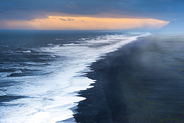 Dramatic clouds, black sandy beach near Dyrholaey, south coast, Southern Region, Iceland, Europe