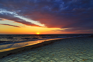 Sunset at sea with cloudy sky, Mari Ermi, Sinis Peninsula, Province of Oristano, Sardinia, Italy, Europe