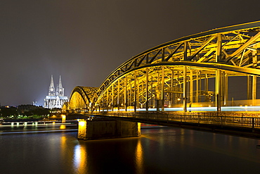 The illuminated Cologne Cathedral and Hohenzollern Bridge at night with Rhine, Deutz, Cologne, North Rhine-Westphalia, Germany, Europe