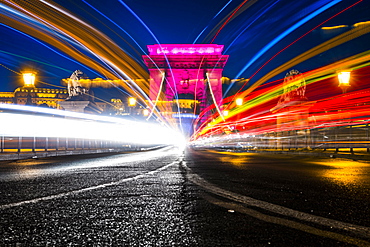 Illuminated chain bridge with traces of light at night, Budapest, Hungary, Europe