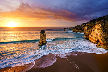 Sunrise on the beach Praia da Dona Ana, Lagos, Algarve, Portugal, Europe