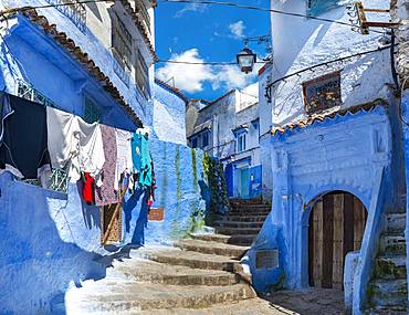 Stairs through narrow alley, blue houses, medina of Chefchaouen, Chaouen, Tanger-Tetouan, Morocco, Africa