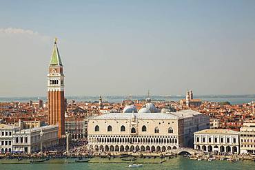 Top view of National Library of St Mark's or Biblioteca Nazionale Marciana, the Campanile bell tower and Doge's Palace at St Mark's Square filled with tourists, San Marco district, Venice, Veneto, Italy, Europe