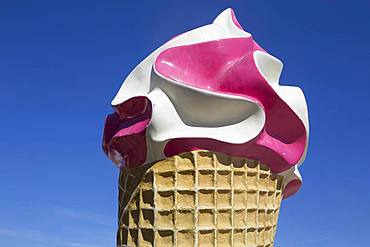 Large ice sculpture made of plastic as advertisement for an ice cream parlour in front of a blue sky, le Gurp, Grayan-et-l`Hopital, Aquitaine, Gironde, France, Europe