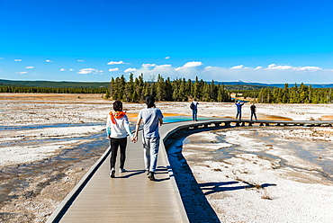 Two tourists on a jetty in the thermal area, hot spring, Grand Prismatic Spring, Midway Geyser Basin, Yellowstone National Park, Wyoming, USA, North America