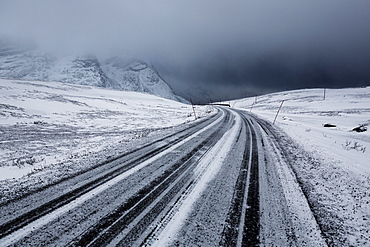 Winter storm, dark clouds above the pass road Rekvikvegen, Tromsoe, Norway, Europe