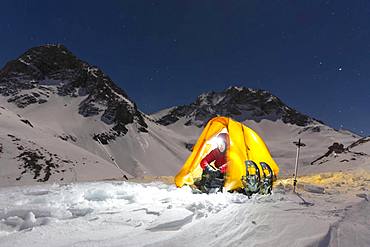 Snowshoe hikers in an illuminated tent in the snow on the Maedelejoch, night shot, near Kemptner Huette, Allgaeu Alps, Tyrol, Austria, Europe