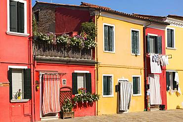 Colourful red and yellow houses, Burano Island, Venice, Veneto, Italy, Europe