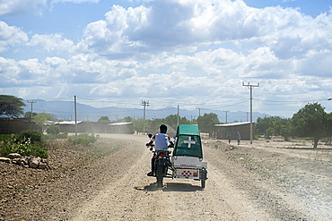 Emergency doctor on motorcycle with sidecar, Omo Valley, South Ethiopia