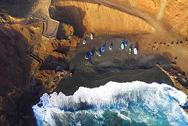 Fishing boats in bay near El Golfo, drone shot, Lanzarote, Canary Islands, Spain, Europe