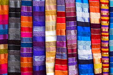 Colorful striped cloths for sale at the street stall, Essaouira, Morocco, Africa