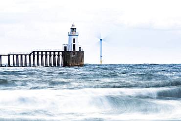 Lighthouse and windmill in the sea, Newcastle upon Tyne, Northumberland, Great Britain