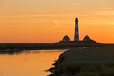 Silhouette, sunset behind the Westerhever Lighthouse, Westerhever, Schleswig-Holstein, Germany, Europe