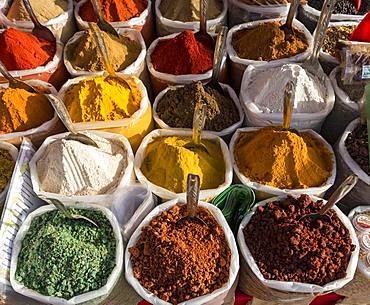 Spices, herbs and curry powders on display at Anjuna Beach Flea Market, Goa, India, Asia