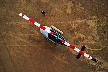 Aerial view, helicopter Bell Jet RANGER 206B for tourist flights on ground, at Wolwedans Dunes Lodge, NamibRand Nature Reserve, Namibia, Africa