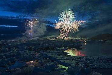 Annual fireworks over the glacier lagoon Joekulsarlon, South Iceland, Iceland, Europe