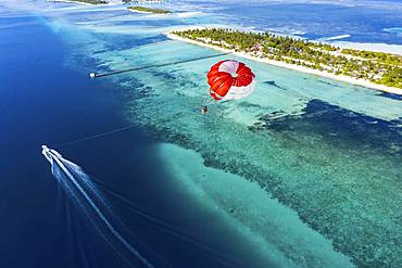 Drone shot, Paraglider flies over Atoll, South-Male-Atoll, Maldives, Asia