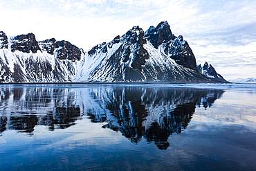 Mountain Vestrahorn with water reflection in the bay of Hornsvik, Austurland, South Iceland, Iceland, Europe