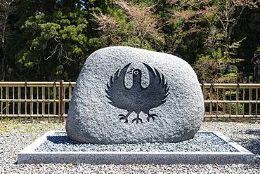 Stone with raven figure, symbol of Kumano Kodo Pilgrimage, Oyunohara Shinto Shrine, Wakayama, Japan, Asia