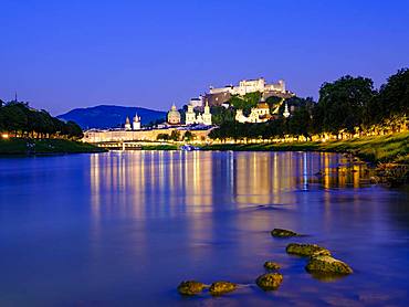 City view, old town and fortress Hohensalzburg over the river Salzach at dusk, Salzburg, Land Salzburg, Austria, Europe