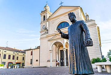 Statue of Don Camillo in Piazza Giacomo Matteotti in front of the Church of Santa Maria Nascente, location of the films of Don Camillo and Peppone, Brescello, Province of Reggio Emilia, Emilia-Romagna, Italy, Europe