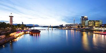 Sunken City and city view with Danube at dusk, Danube Island, Donaucity, Vienna, Austria, Europe