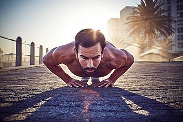 Young man training, doing push-ups, outdoor sports, gymnastics, Cape Town, South Africa, Africa