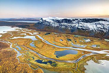 View from mountain Skierffe to the autumnal river delta Rapadalen, river Rapaaelv, Sarek National Park, Laponia, Lapland, Sweden, Europe