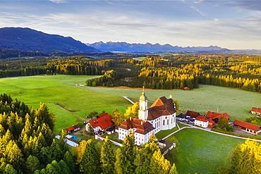 Wieskirche in the morning light, pilgrimage church to the Scourged Saviour on the Wies, Wies, near Steingaden, Pfaffenwinkel, aerial view, Upper Bavaria, Bavaria, Germany, Europe