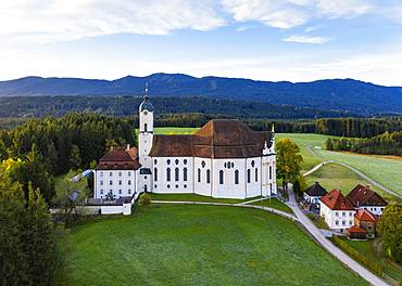 Wieskirche in the morning light, pilgrimage church to the Scourged Saviour on the Wies, Wies, near Steingaden, Pfaffenwinkel, aerial view, Upper Bavaria, Bavaria, Germany, Europe