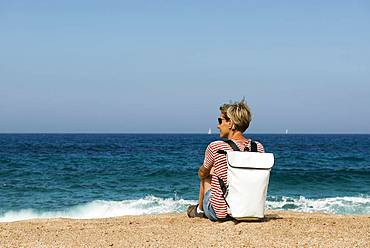 Woman on a beach, near Sartene, Corsica, France, Europe