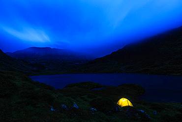 Illuminated tent at night, Lower Lake Giglach, Schladminger Tauern, Styria, Austria, Europe