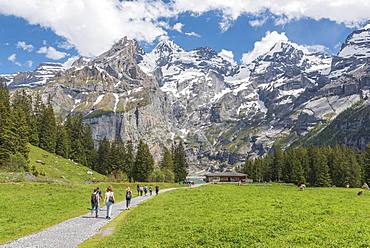 Hiking trail to the Restaurant Zur Sennhuette at the Oeschinensee, behind Blueemlisalp, Kandersteg, Bernese Oberland, Canton of Bern, Switzerland, Europe