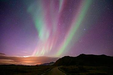 Northern Lights over mountain landscape (Aurora borealis), Lofoten, Norway, Europe